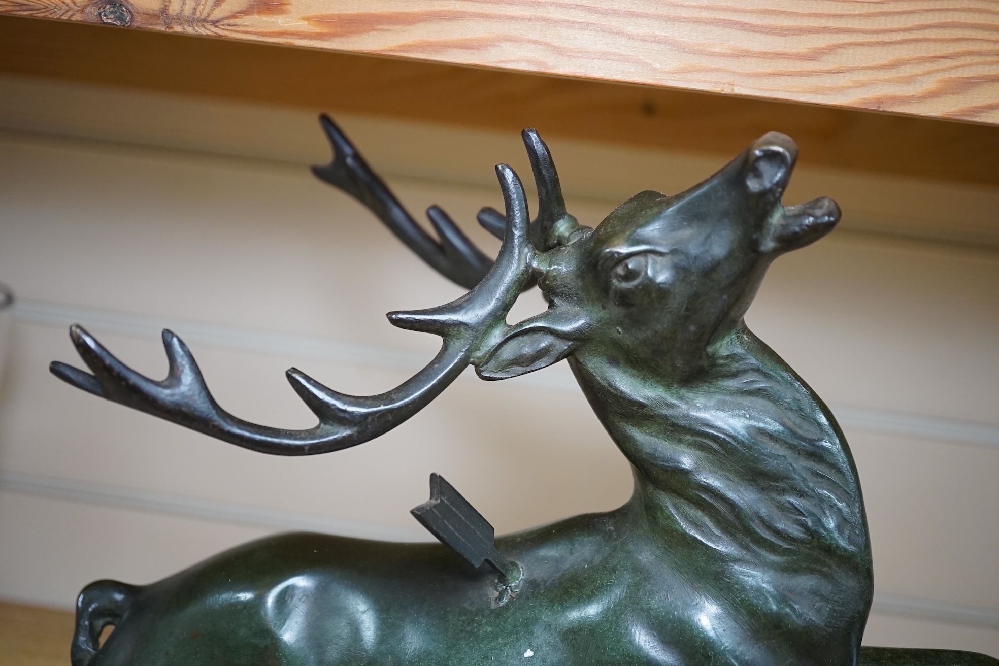 A bronze model of a stag raised on rectangular marble base, 45cm wide. Condition - good